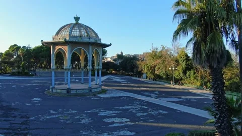 Camera flying over a public garden in Caltagirone Sicily Stock Footage 166644159