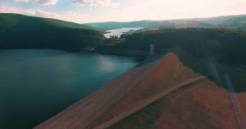 camera flying over the water oasis towards the mountains and the river as the s Stock-Footage 71017753
