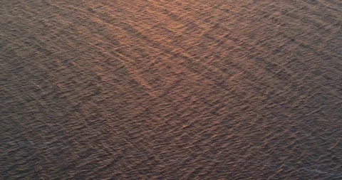 Camera flying over the water-sunset landscape Stock Footage 93664989