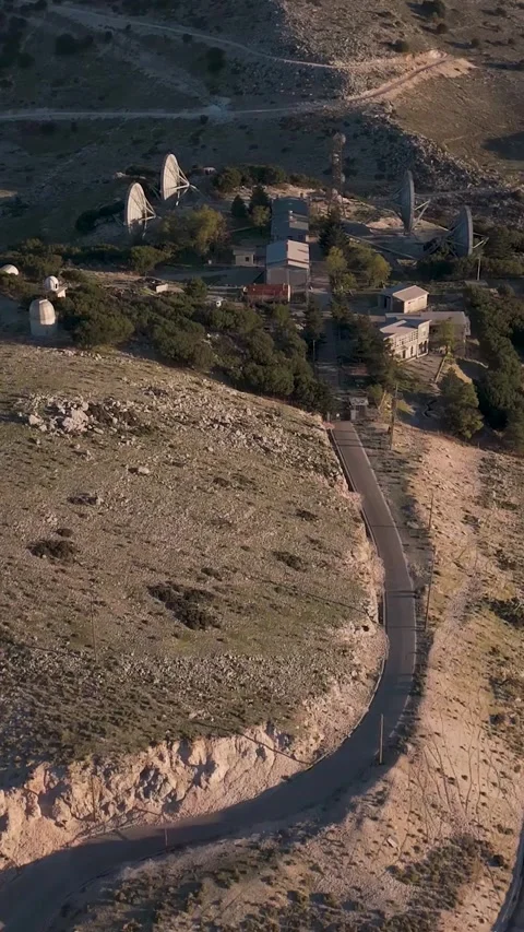 Camera flying over winding mountain road leading to observatory Video stock 290449890
