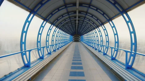 Camera flying through a glass tunnel. The transition between the terminals of Stock Footage 64960915