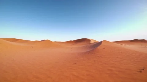 Camera is flying through a red desert - dunes around Stock Footage 154171998