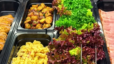 Camera Flyover of Buffet Spread with Salad Chicken Potatoes and Bacon Stock Footage 341388726