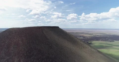 Camera flys to the top of SP Crater in Northern Arizona Stock Footage 203294793