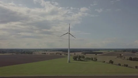 Camera focus on working windmill. Energy production. Sustainability- Aerial Stock Footage 83819729