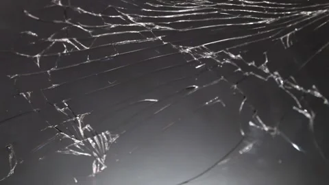 The camera focuses on a shattered screen showcasing complex crack patterns Stock Footage 292761073
