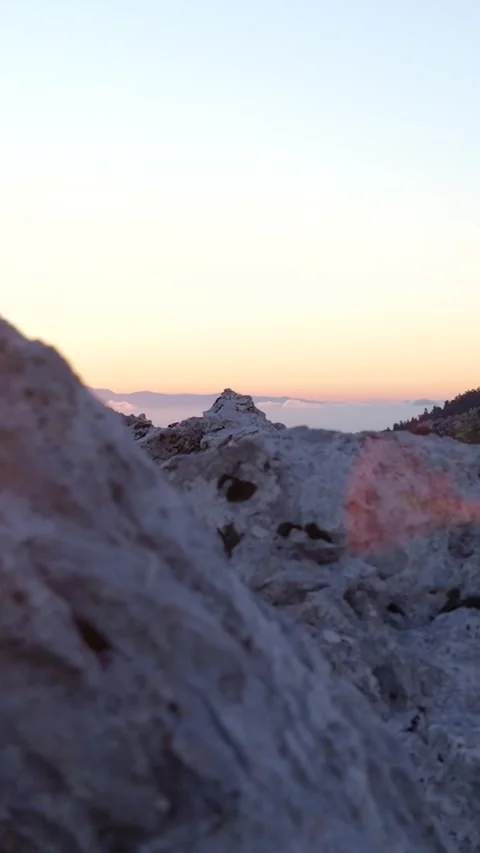 Camera focusing on mountain peak during golden hour Stock Footage 290449336