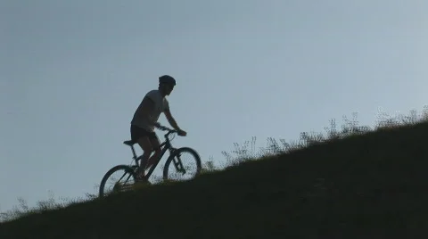 Camera following mountainbiker Stock Footage 87382