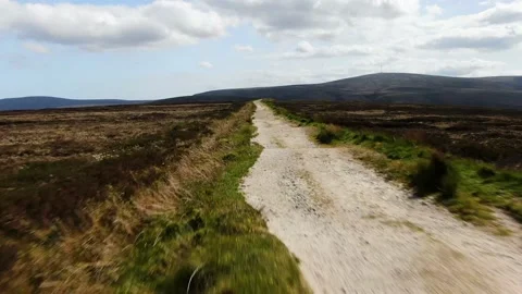 Camera following path towards mountain Stock Footage 133060346