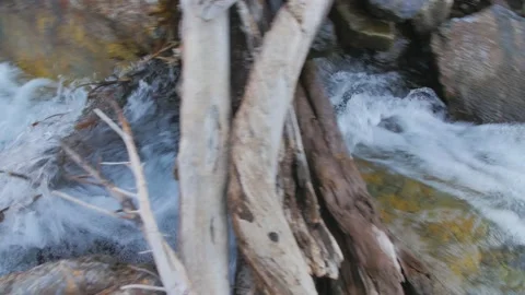 Camera following rough and cold stream river down the rocks Stock Footage 146028345
