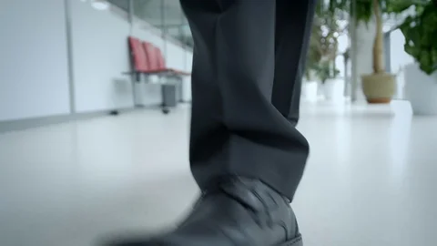 Camera following steps of businessman from the front Stock-Footage 75552093