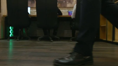 Camera following steps of businessman from the front. Close-up of confident Stock Footage 94109091