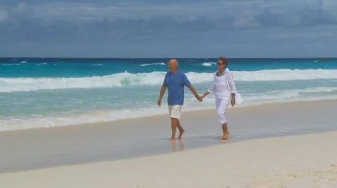 Camera following walking seniors Stock Footage