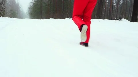Camera follows after the running young woman. Slow motion. Stock Footage 71681398