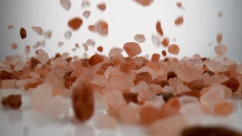 Camera follows colored salts falling on surface. Slow Motion. Video stock 128767161