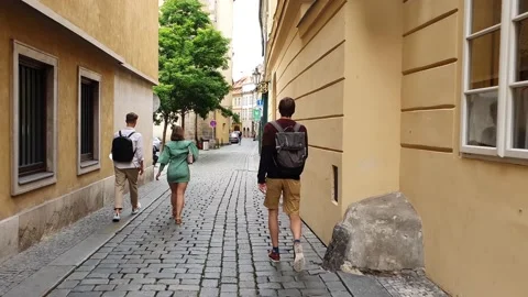 The camera follows the guy with the backpack. Stock Footage 166948862