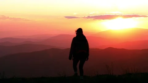 Camera follows hipster millennial young woman running up on top of mountain Stock Footage 137030237