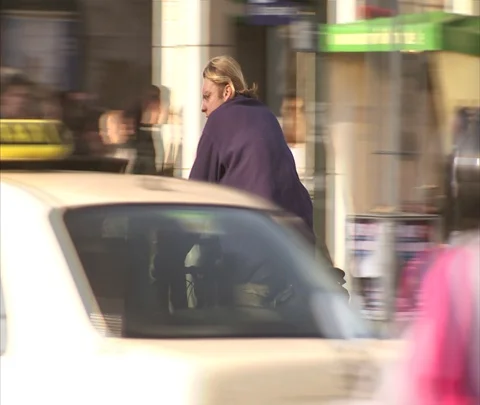 Camera follows man riding bicycle through traffic Stock Footage 86743005