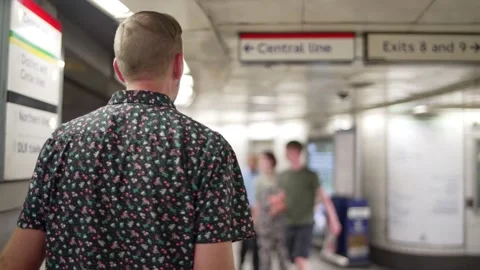 Camera follows man walking through London Underground Station Stock-Footage 233848265