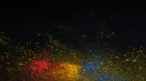 Camera follows particles exploding against black background. Slow Motion. Stock Footage 55534891