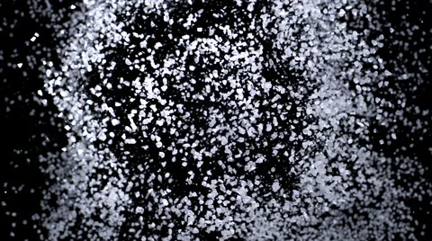 Camera follows particles exploding against black background. Slow Motion. 스톡 동영상 55535258