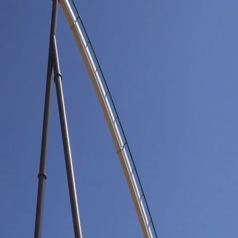Camera follows roller coaster ride on an amusement park Vídeos de archivo 69734209