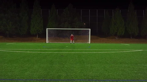 The camera follows a soccer player down the field as he makes a goal Video stock 57439661