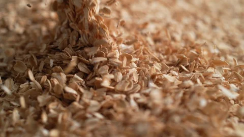 Camera follows throwing oats over a pile of oats. Slow Motion. Stock Footage 94230935
