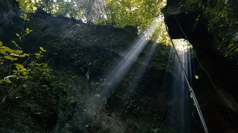 Camera footage of the sunlight beams through the rocks Stock Footage 98516667