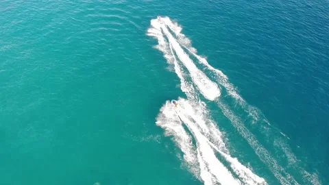 Camera forward and rotate under the sea. Jet skis perform stunts Stock Footage 150580709
