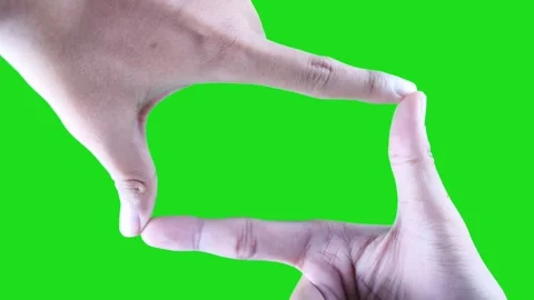 Camera frame gesture isolated on green screen background Stock Footage 322771049