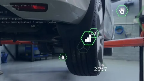 Camera framing rear-right wheel, AR hex icons spawning and updating, visualizing Stock Footage 335282398