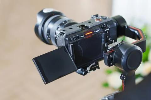 Camera on a gimbal setup for smooth recording in a bright indoor space Stock Photos