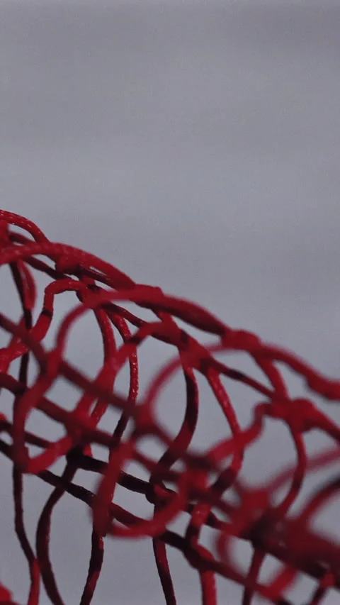 The Camera Glides Along A Red Safety Net, Which Gently Sways Or Flutters Due To  Stock Footage 319206825
