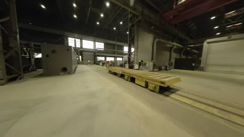 Camera glides from boiler unit to spacious production hall Stock Footage 304414862