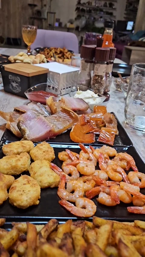 Camera glides over festive dining table filled with seafood Stock Footage 308823774