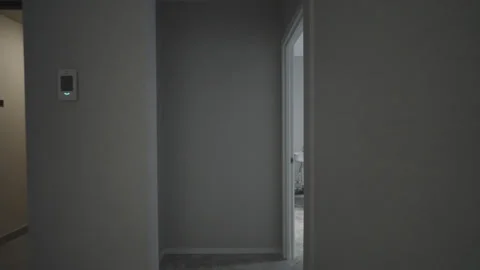 Camera glides through corridor toward kitchen with balcony 動画素材 330572598