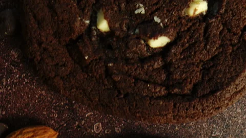 Camera Gliding Over Chocolate Cookie Texture With Almond Pieces and Chocolate Stock Footage 331980246
