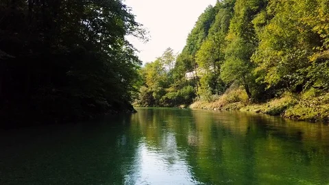 Camera gliding over the surface of a calm river Stock Footage 108731203