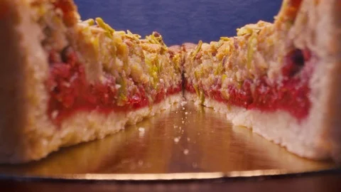 The camera goes between two pieces of raspberry pie. Stock Footage 119467428