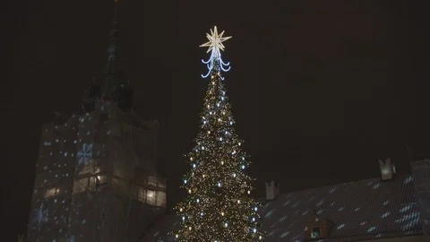 Camera goes down and we see a beautiful highlighted Christmas tree in the old Stock Footage 108521922