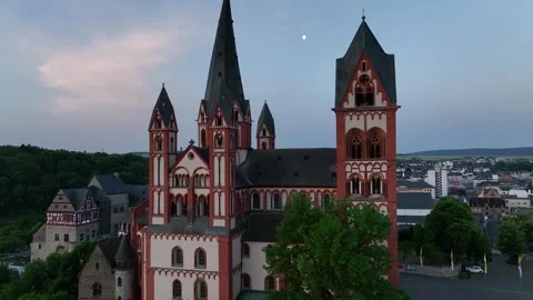 The camera goes down around the tower of tourist attraction Limburg Cathedral Stock Footage 243787825