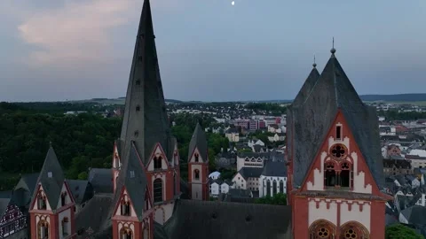 The camera goes down around the tower of tourist attraction Limburg Cathedral Stock Footage 247429761