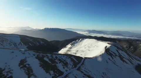 The camera goes over the mountains with snow. Aerial  video drone. N. Stock Footage 63453938