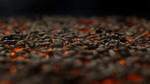 Camera going back, revealing fresh coffe beans roasting on a hot platform Stock Footage 129493669