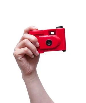 Camera in a hand isolated on white background Stock Photos