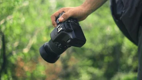 Camera in the hand of photographer Stock-Fotos