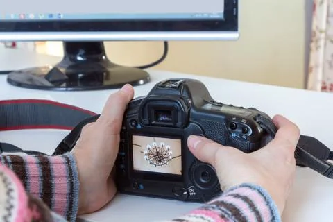 The camera in the hands Stock Photos