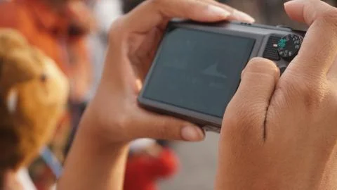 Camera on hands Stock Photos
