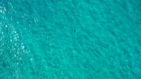 Camera hangs over the turquoise sea water Stock Footage 101486863